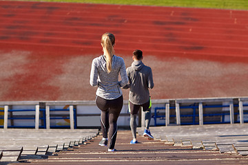 Image showing couple walking downstairs on stadium