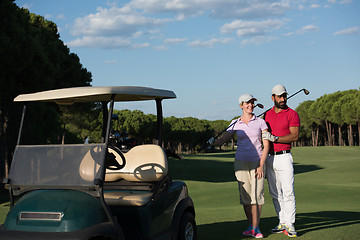 Image showing couple in buggy on golf course