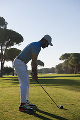 Image showing golf player hitting shot