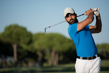 Image showing pro golfer hitting a sand bunker shot