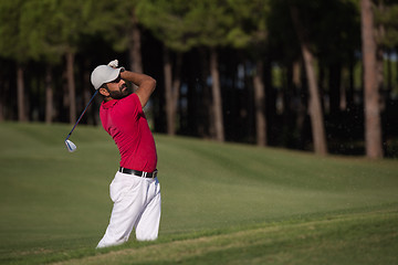 Image showing golfer hitting a sand bunker shot