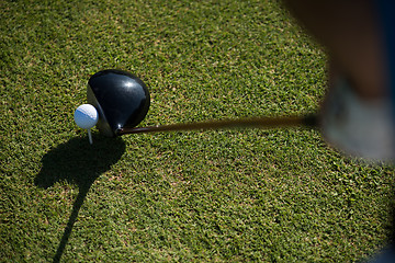 Image showing top view of golf club and ball in grass