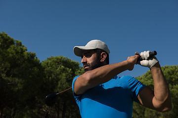 Image showing golf player hitting shot