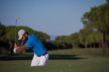 Image showing pro golfer hitting a sand bunker shot