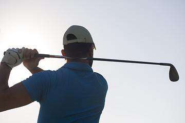 Image showing golf player hitting shot