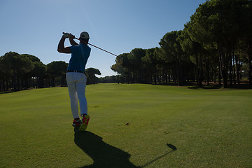 Image showing golf player hitting shot