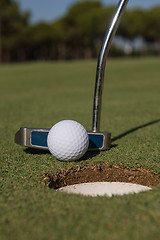 Image showing hitting golf ball to hole