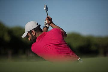 Image showing golfer hitting a sand bunker shot