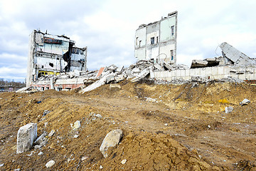 Image showing Pieces of Metal and Stone are Crumbling from Demolished Building