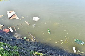 Image showing Rubbish, waste floating in polluted pond