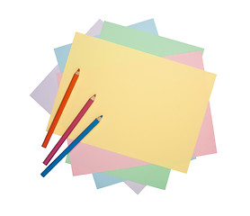 Image showing Color pencils and colorful paper