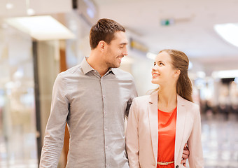 Image showing happy young couple with shopping bags in mall