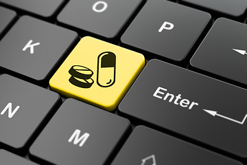 Image showing Medicine concept: Pills on computer keyboard background