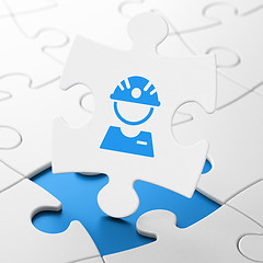 Image showing Manufacuring concept: Factory Worker on puzzle background