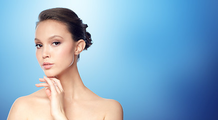 Image showing face of beautiful asian woman with golden ring