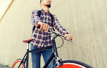 Image showing hipster man with fixed gear bike and backpack