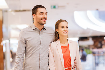 Image showing happy young couple with shopping bags in mall