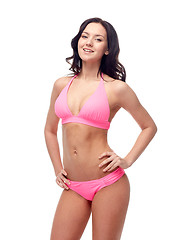 Image showing happy young woman in pink bikini swimsuit