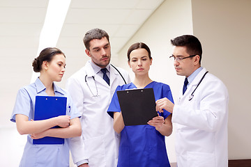 Image showing group of medics at hospital with clipboard