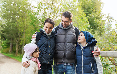 Image showing happy family with backpacks hiking