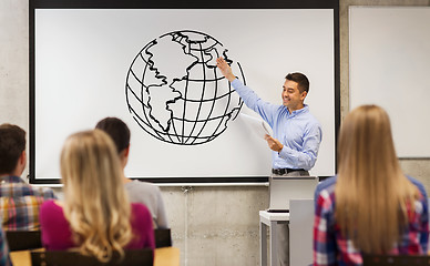 Image showing group of students and happy teacher at white board