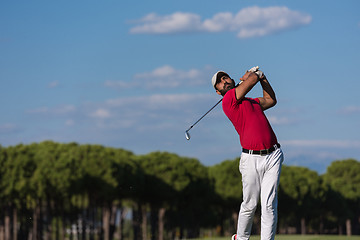 Image showing golf player hitting long shot