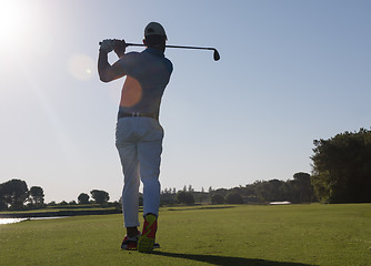 Image showing golf player hitting shot