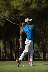 Image showing golf player hitting shot