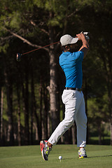 Image showing golf player hitting shot