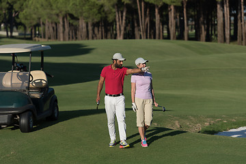 Image showing couple walking on golf course