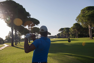 Image showing golf player hitting shot