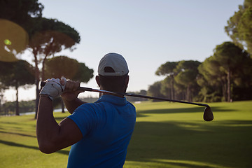 Image showing golf player hitting shot