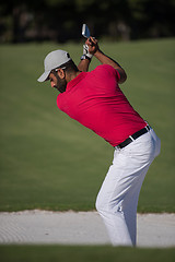 Image showing golfer hitting a sand bunker shot