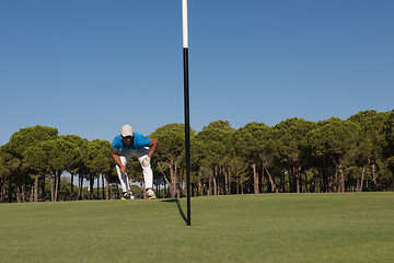 Image showing golf player aiming perfect  shot