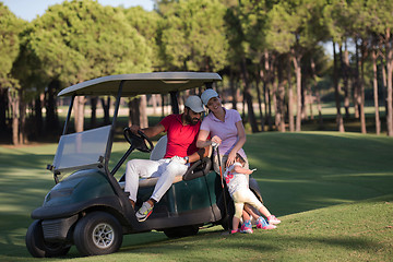 Image showing couple in buggy on golf course