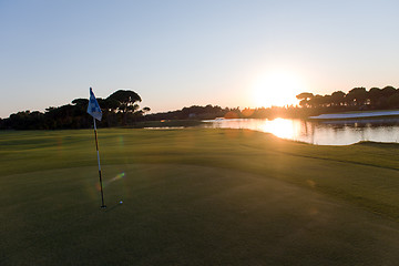 Image showing golf ball on edge of  the hole