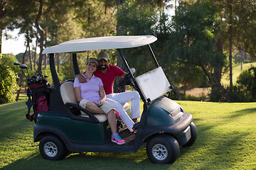 Image showing couple in buggy on golf course