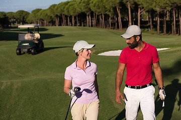 Image showing couple walking on golf course