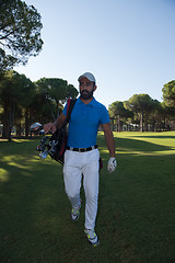 Image showing golf player walking