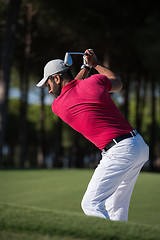 Image showing golfer hitting a sand bunker shot