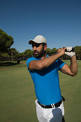 Image showing golf player hitting shot