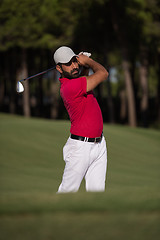 Image showing golfer hitting a sand bunker shot