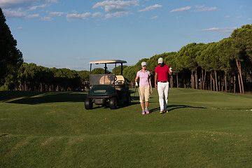 Image showing couple walking on golf course