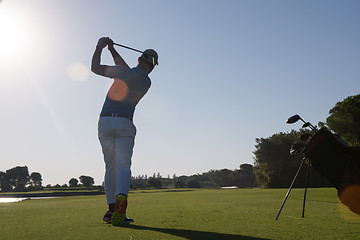 Image showing golf player hitting shot