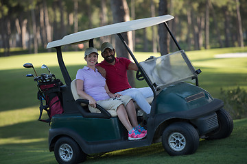 Image showing couple in buggy on golf course