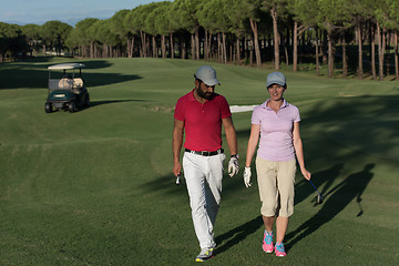 Image showing couple walking on golf course