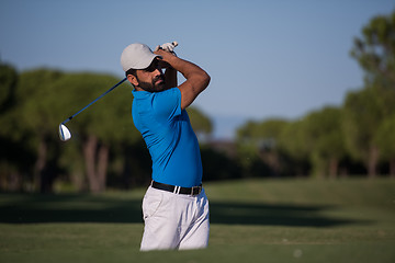 Image showing pro golfer hitting a sand bunker shot