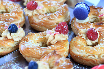 Image showing cream puff with raspberries and blueberries