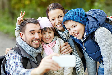 Image showing family taking selfie with smartphone in woods