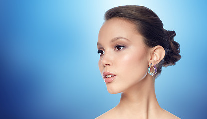 Image showing close up of beautiful woman face with earring